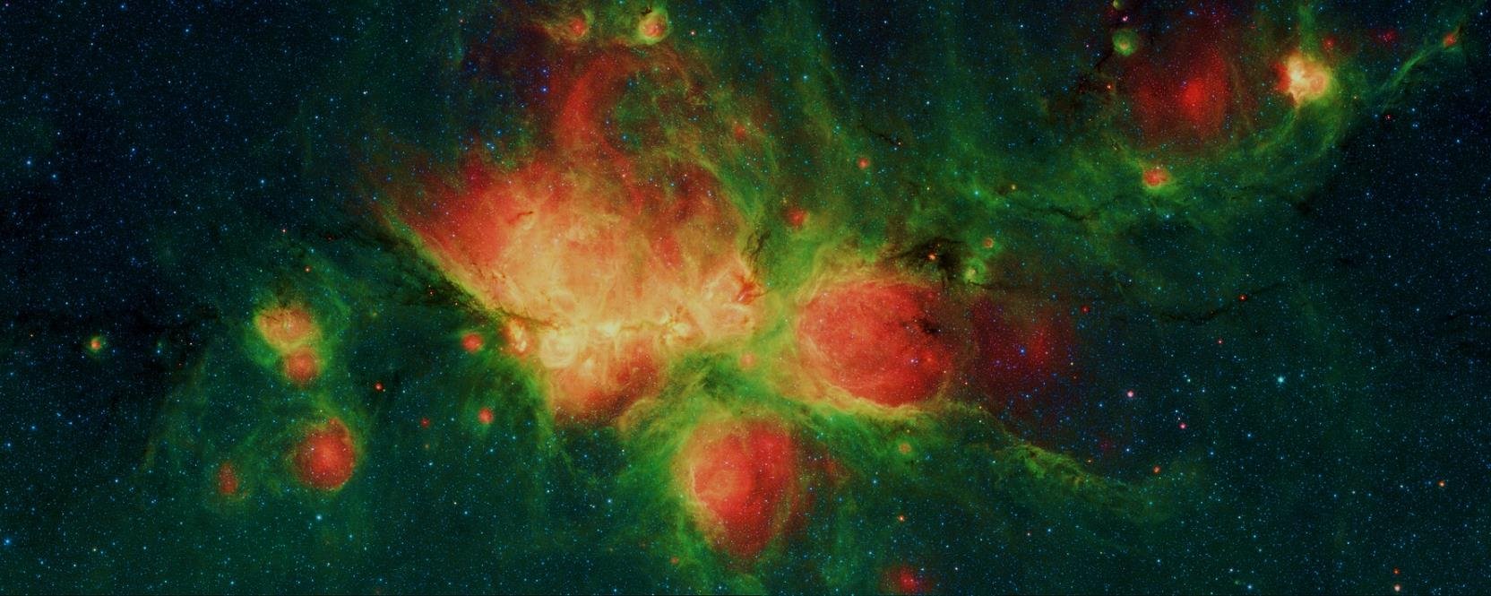 Infrared image of the Cat's Paw Nebula, its green glow attributed to polycyclic aromatic hydrocarbons